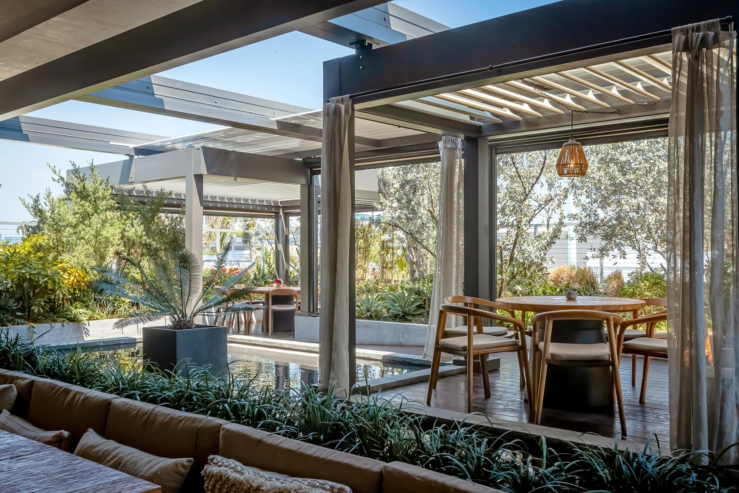 Louvered pergola system allowing airflow and shade control in Long Island, NY