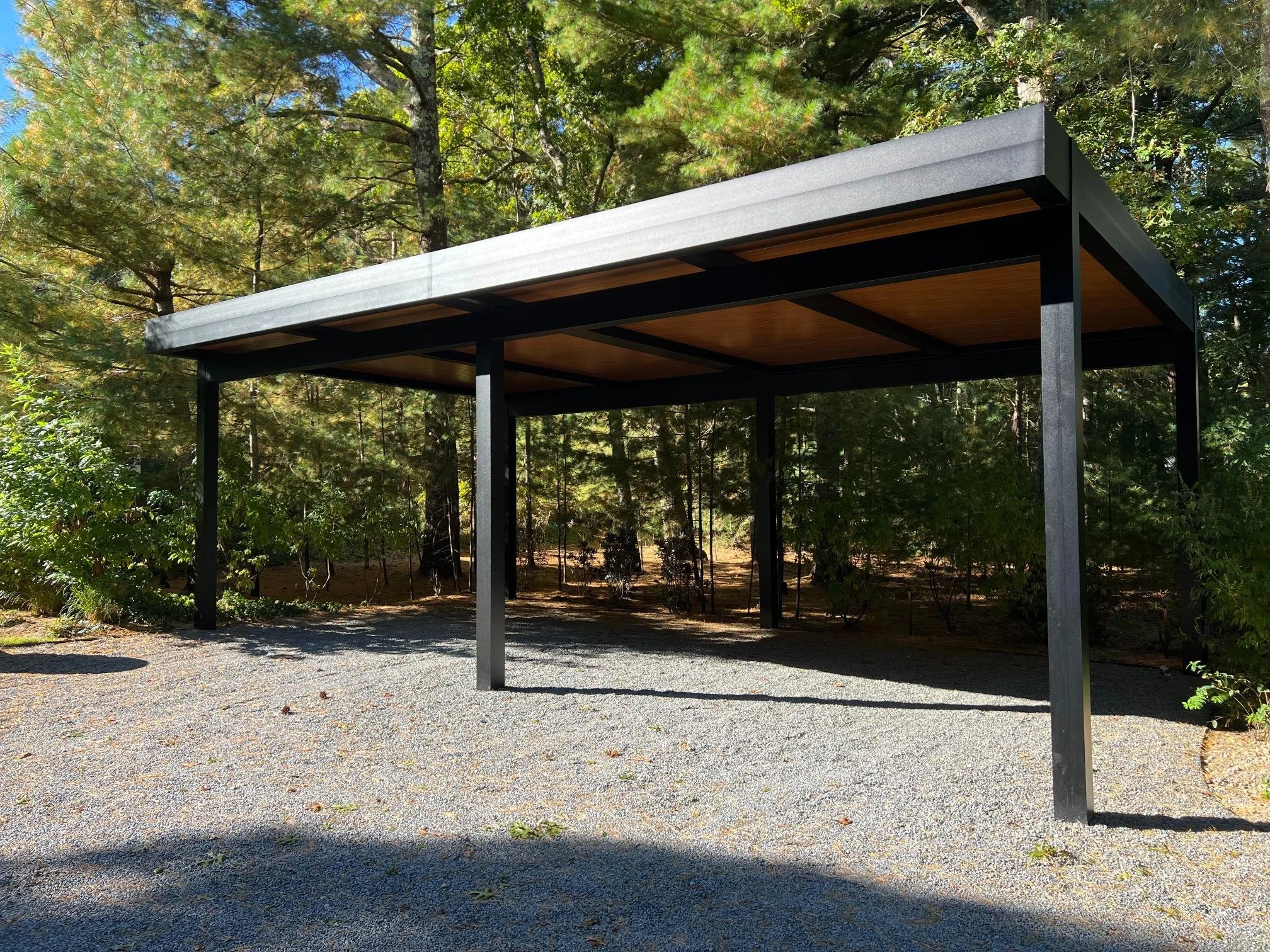 Louvered pergola integrated into a custom outdoor living layout in Long Island, NY