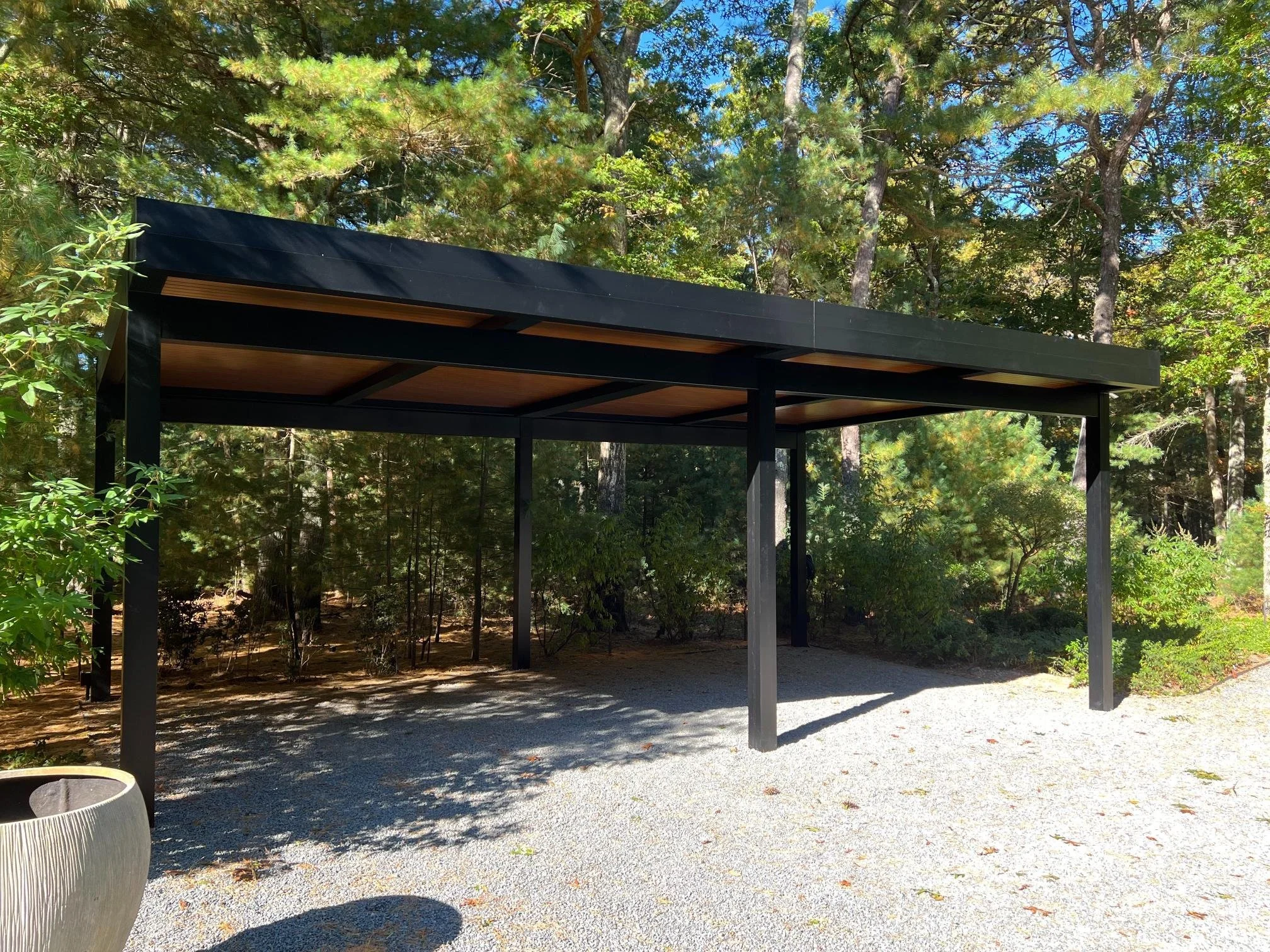 Louvered pergola providing shade coverage for a seating area in Long Island, NY