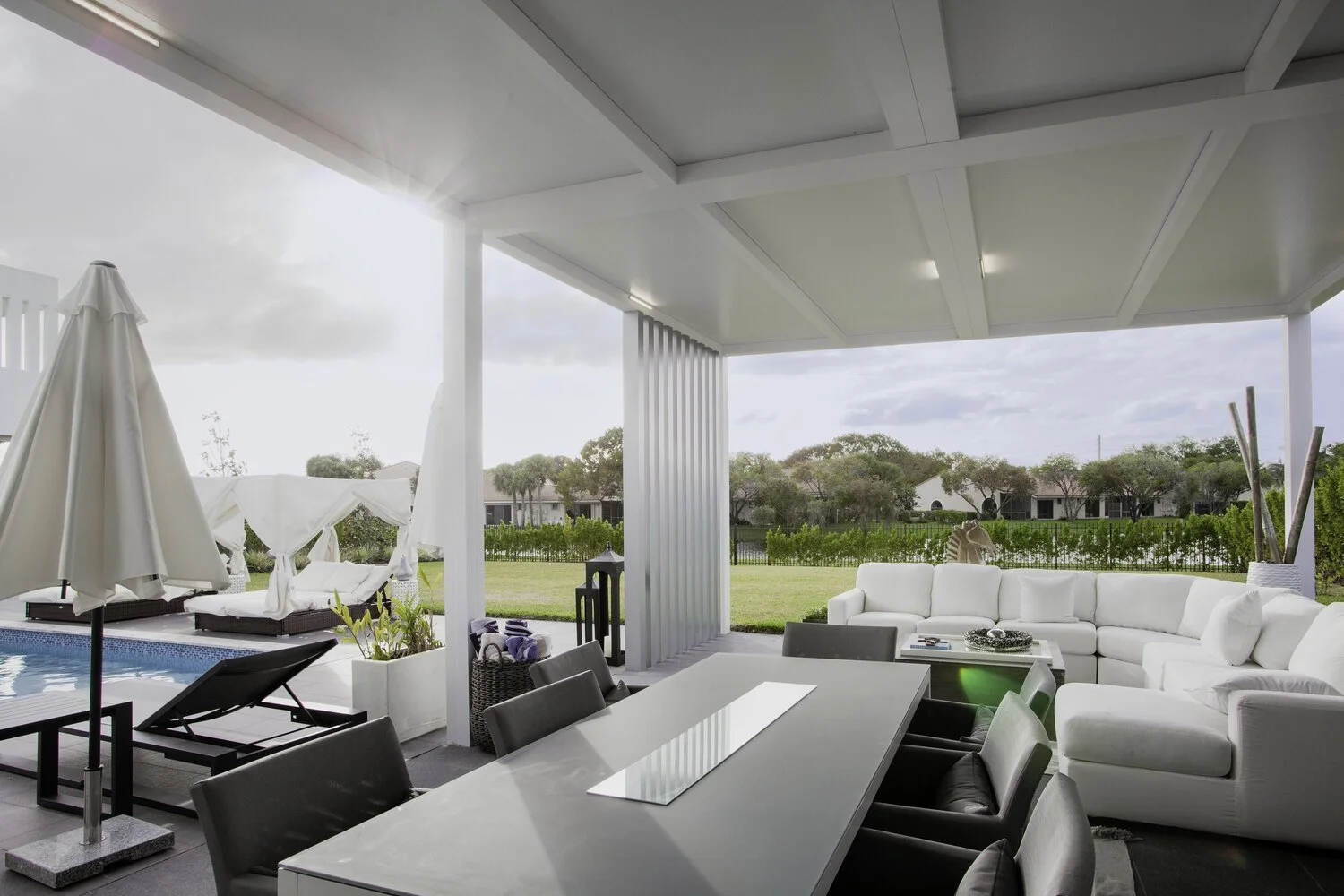 Modern louvered pergola adding structure to a landscaped yard in Long Island, NY