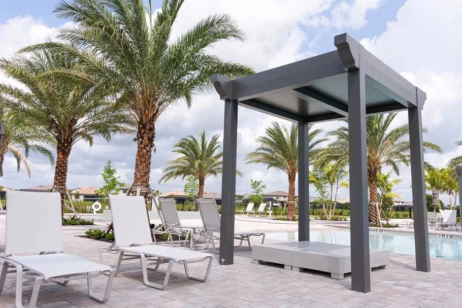 Pergola with adjustable louvers creating a comfortable patio environment in Long Island, NY