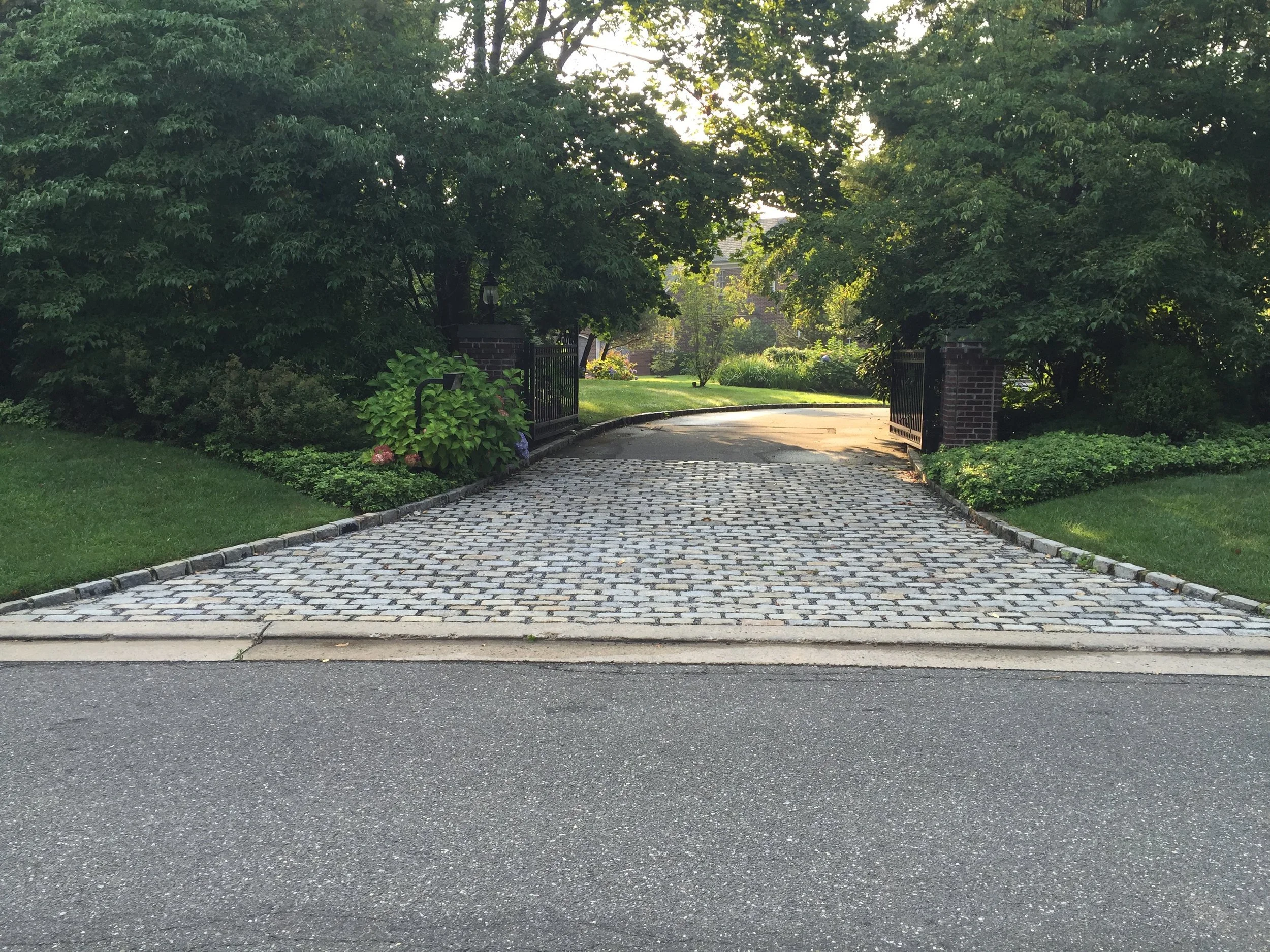 Masonry hardscape project combining natural stone and pavers in Stony Brook, NY