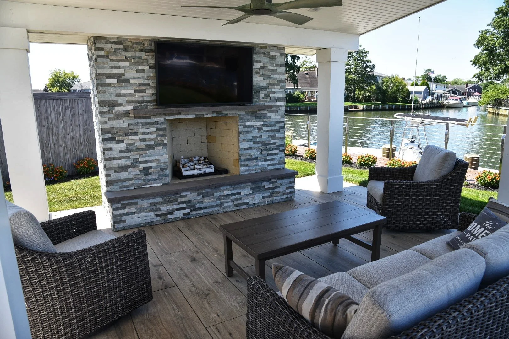 Backyard fire feature with stacked-stone surround and coping in Northport, NY