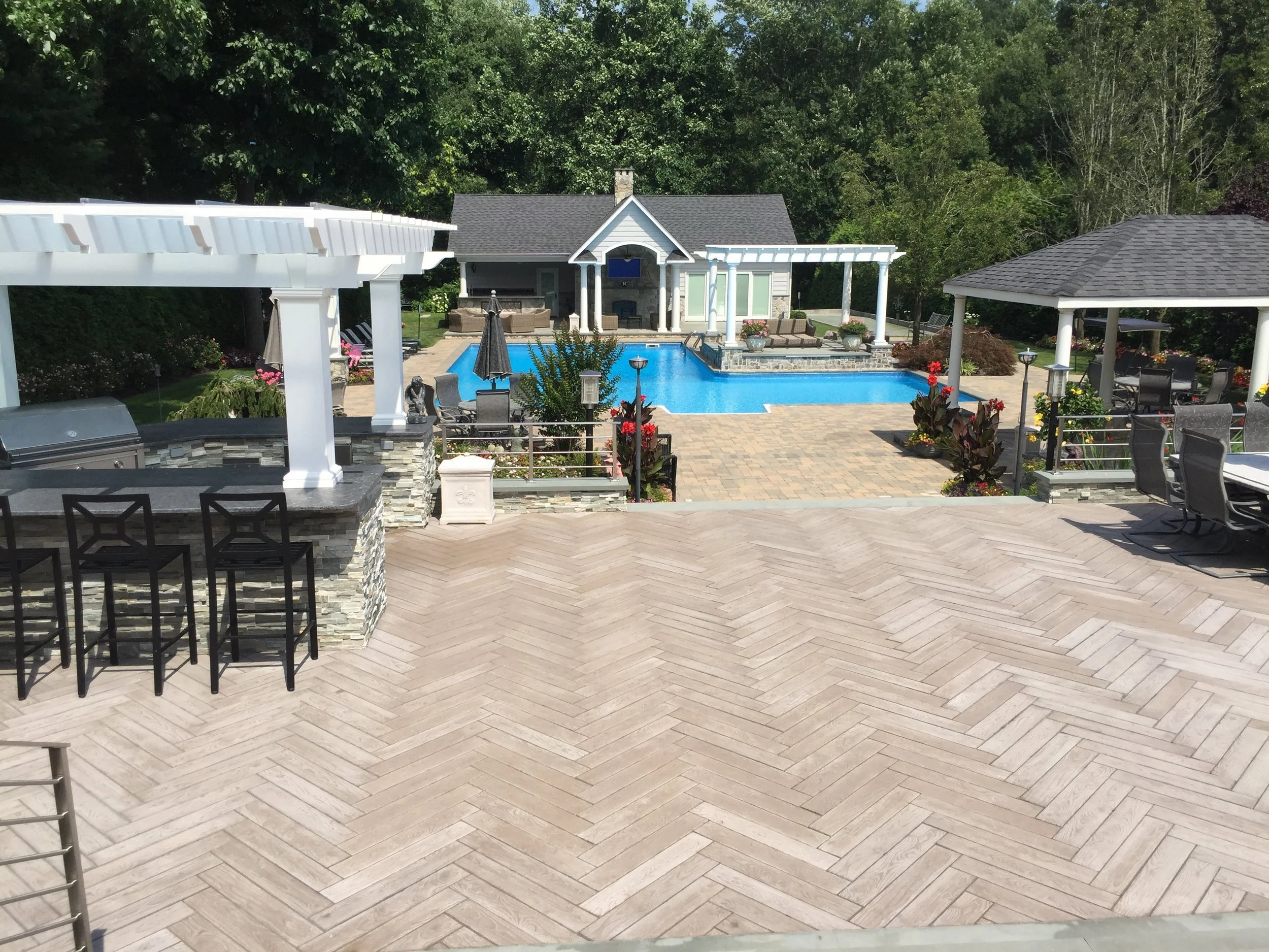 Custom masonry outdoor fireplace paired with comfortable outdoor seating in Sag Harbor, NY