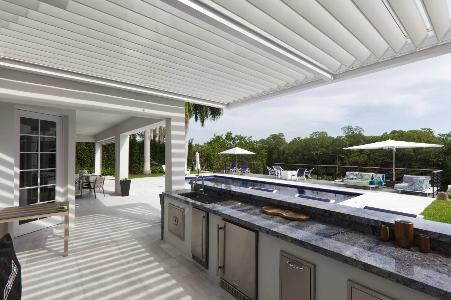 Outdoor kitchen with dedicated prep surfaces and serving space in Stony Brook, NY
