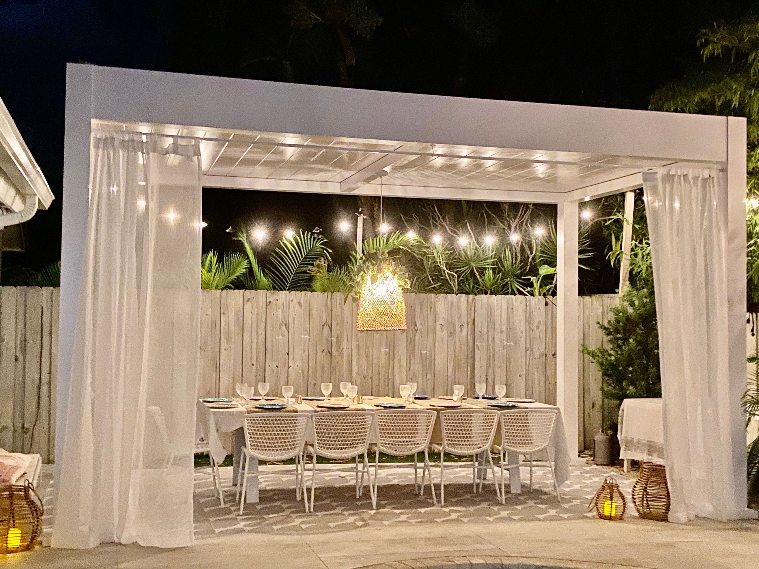 Backyard lighting creating a calm evening atmosphere around outdoor spaces in Mt. Sinai, NY