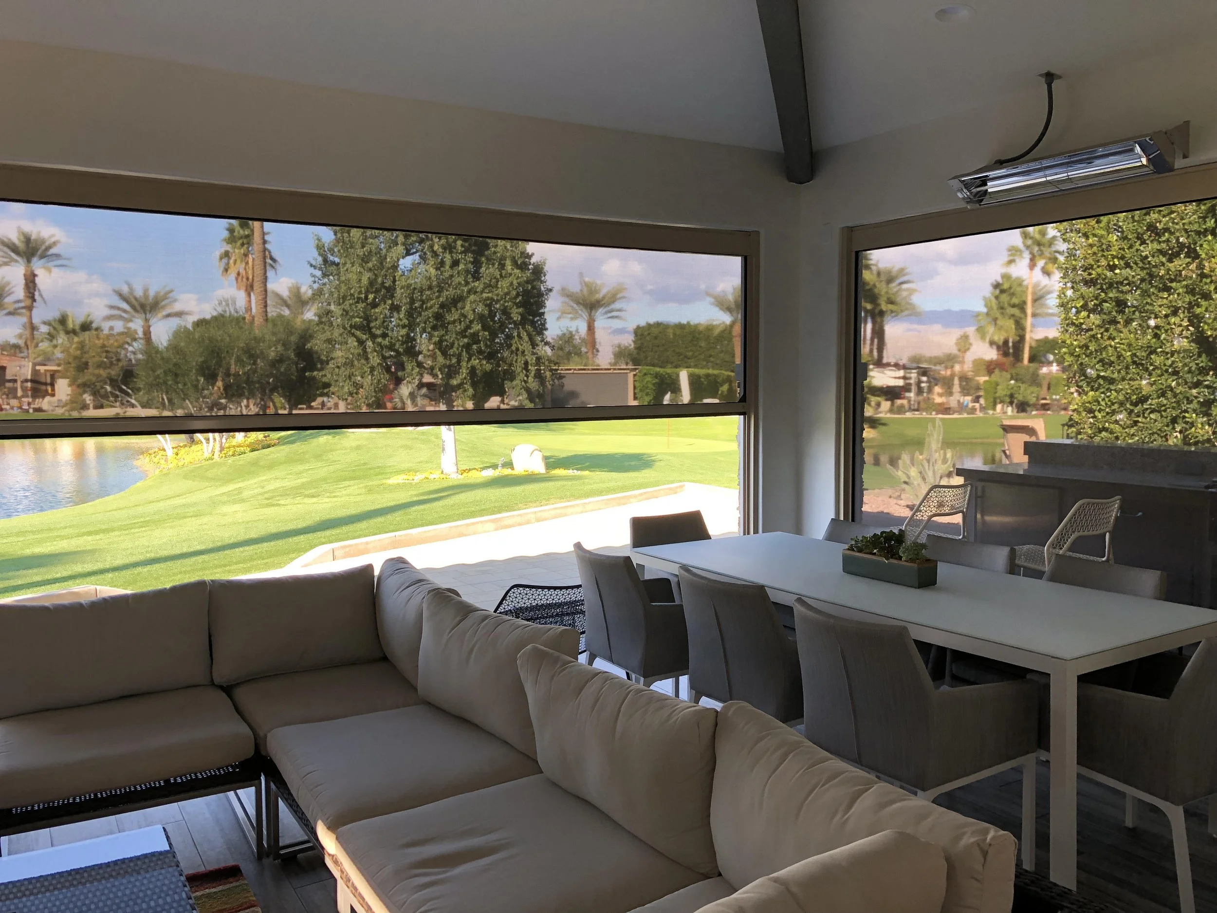 Retractable screens enclosing a covered patio in Deer Park, NY