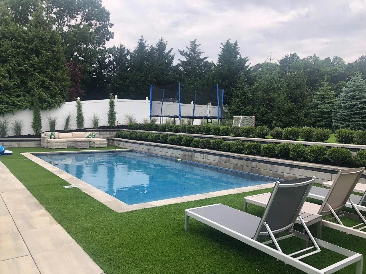 Elegant backyard swimming pool design in Commack, NY