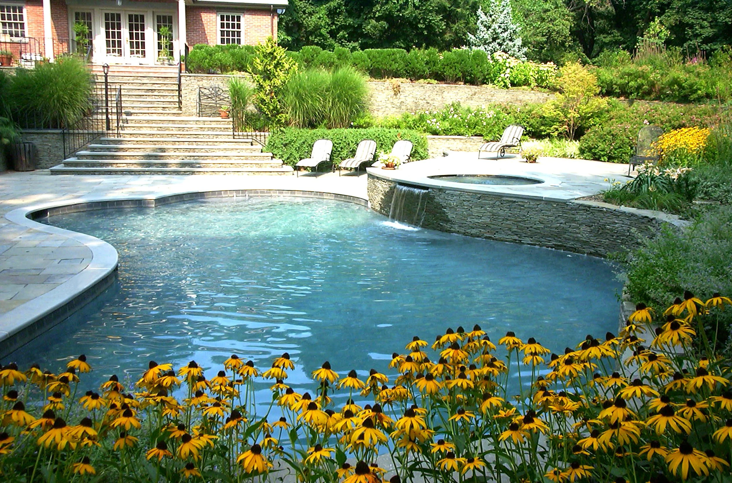 Night-lit pool design in Lloyd Harbor, NY
