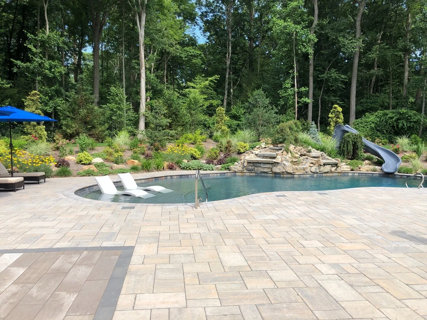 Resort-style swimming pool design in Miller Place, NY