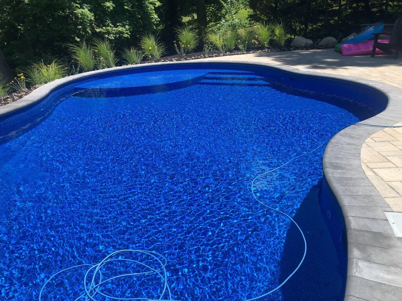 Pool and patio design in Old Westbury, NY