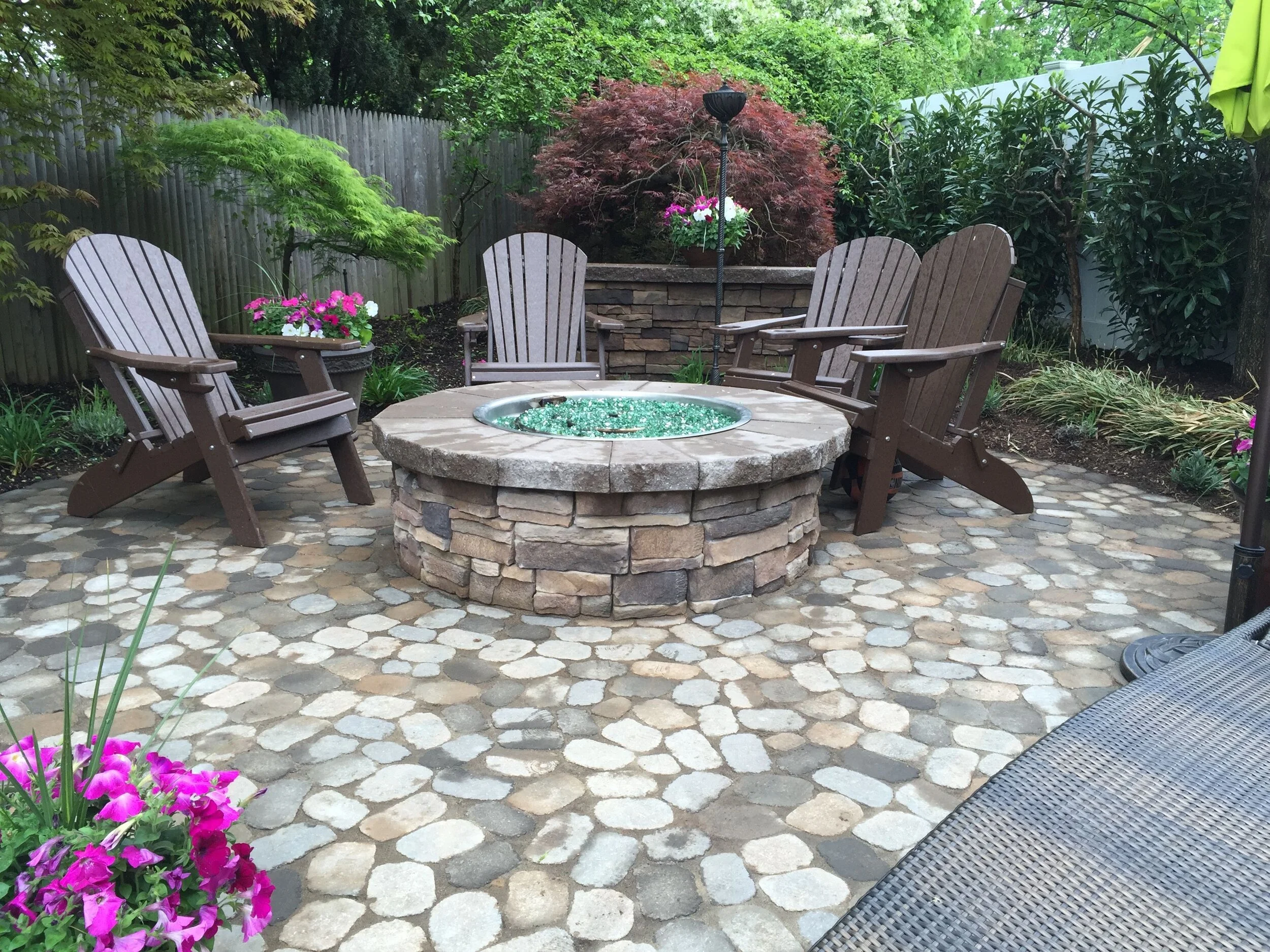 4 Backyard Designs With Masonry Focal Features in Port Jefferson, NY