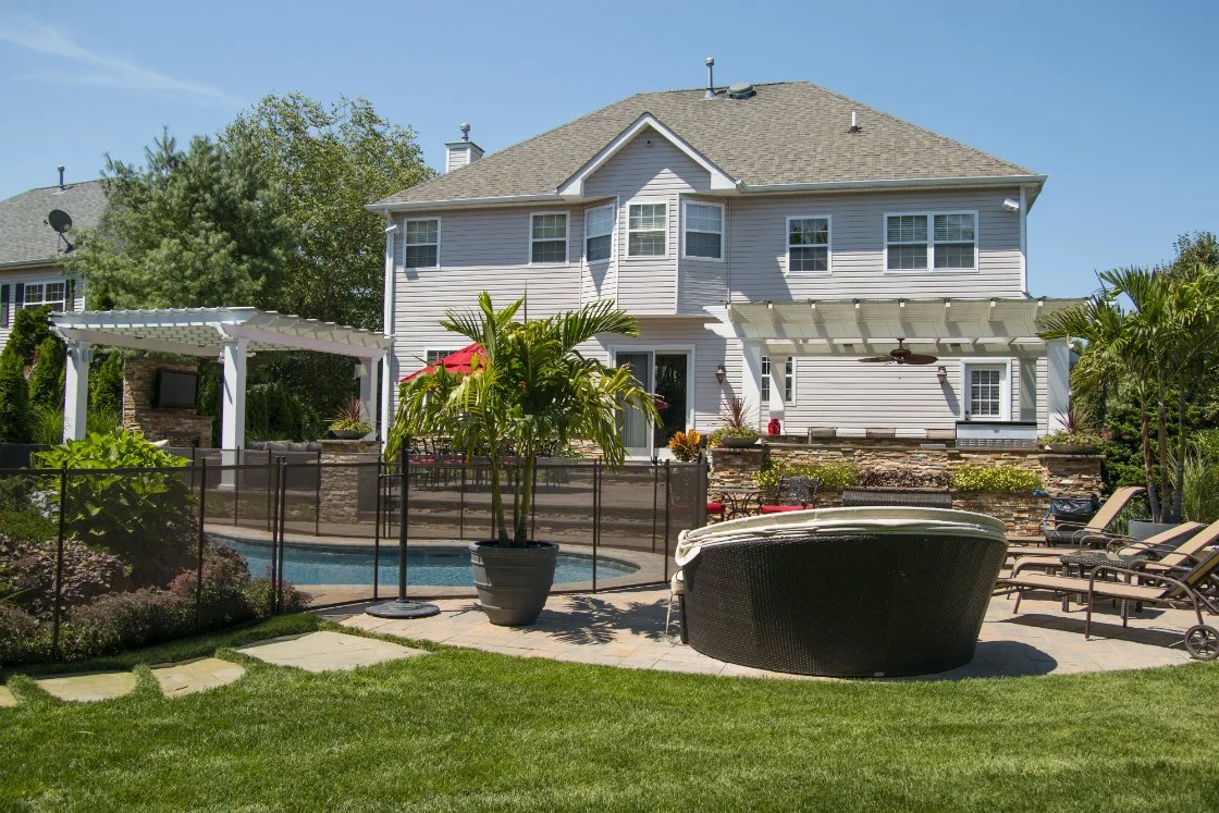 Swimming Pool Designs for a Tropical Backyard Retreat in Port Jefferson