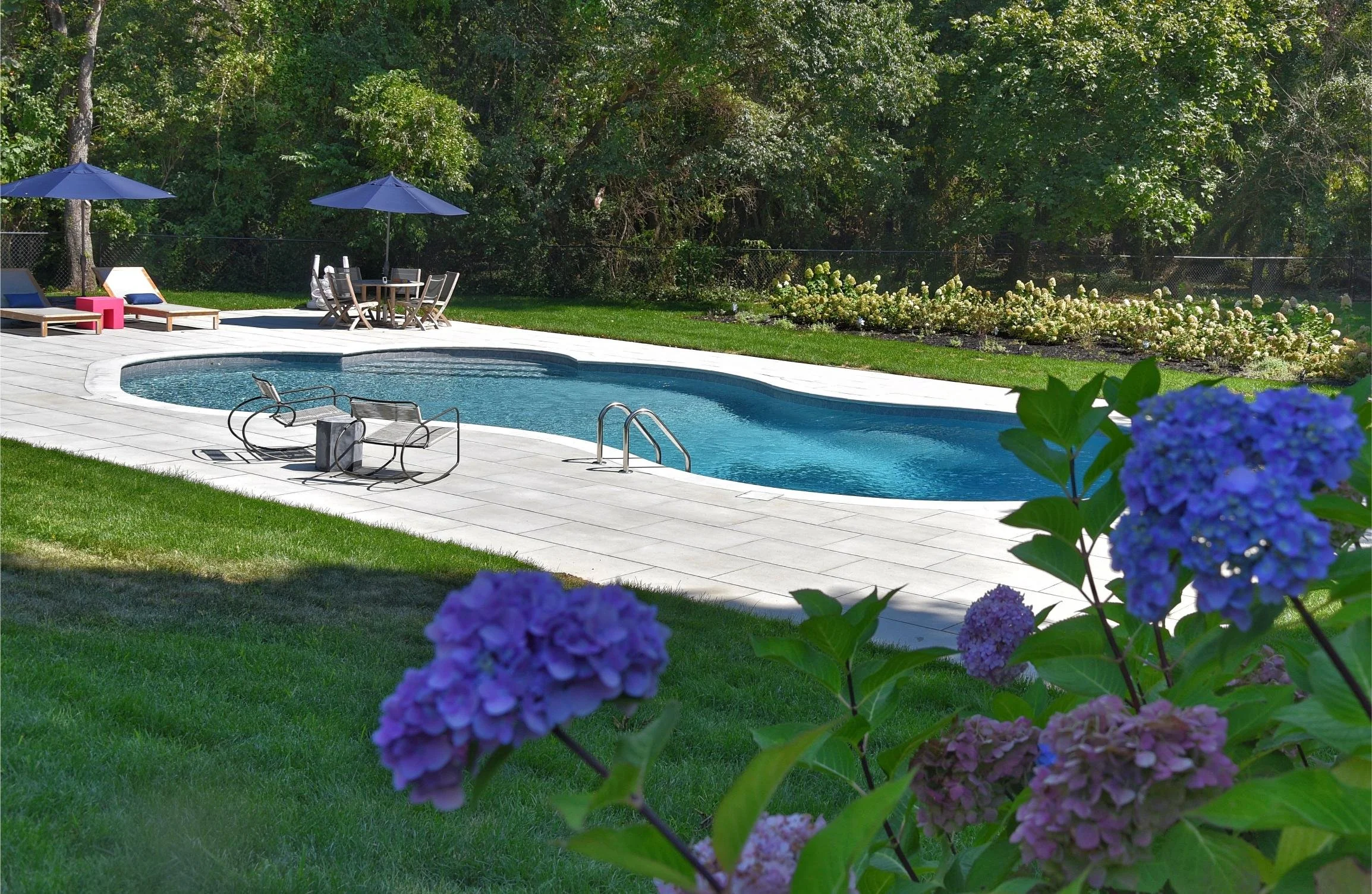 Custom backyard design created to match the home’s architecture in Huntington, NY
