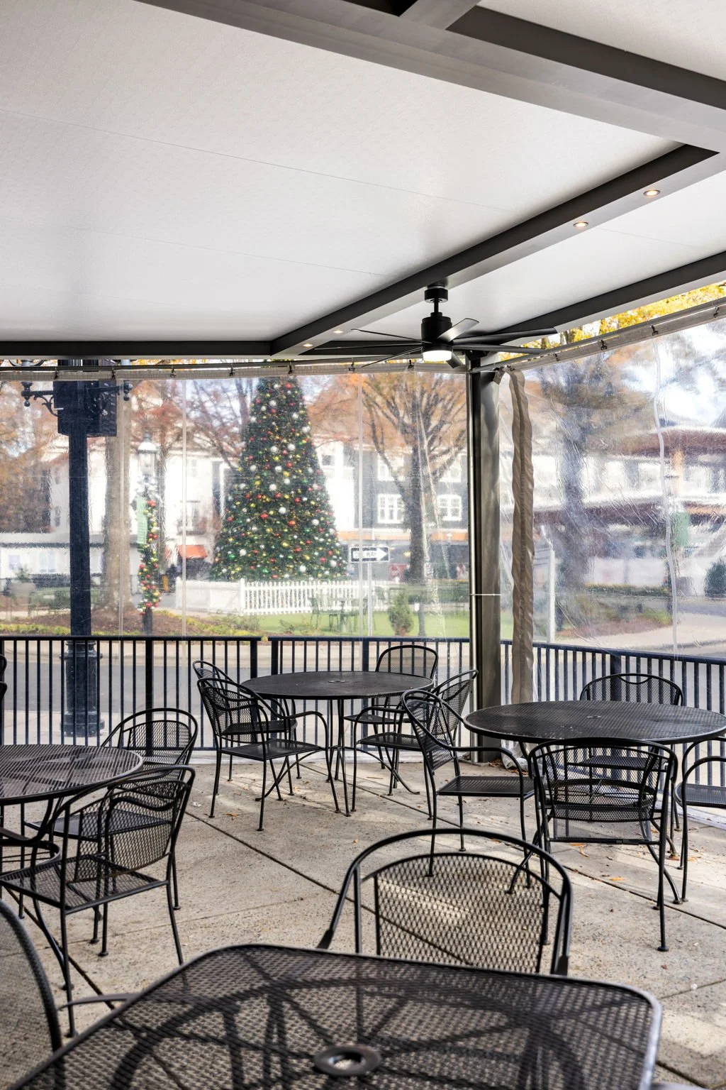 Custom 3-season enclosure integrated with backyard patio design