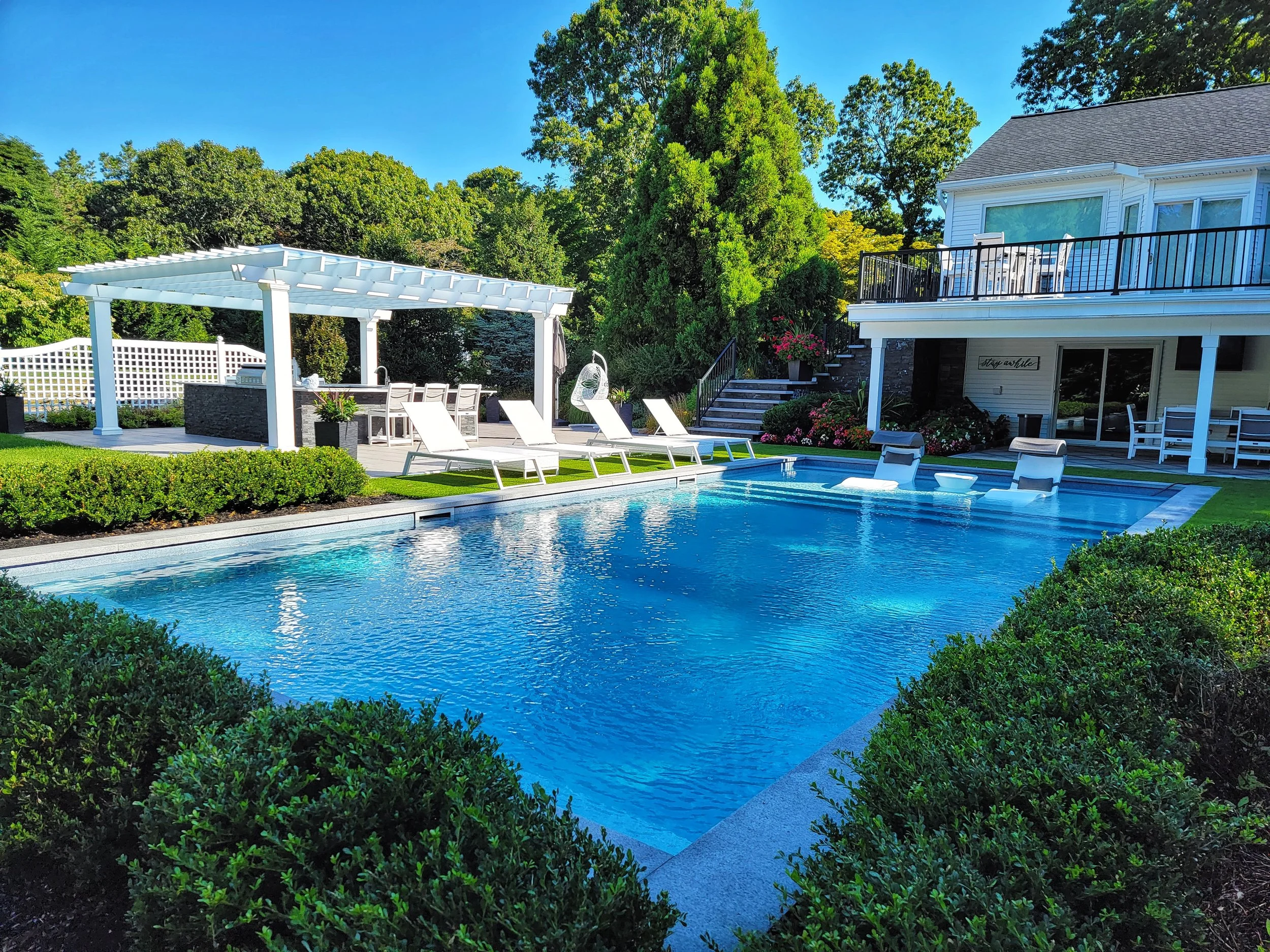 Swimming pool integrated into the landscape for relaxation in Babylon, NY