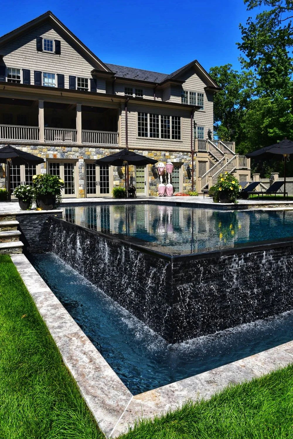 A pool company near me delivered this pool renovation with updated coping and refreshed patio design in Huntington, NY