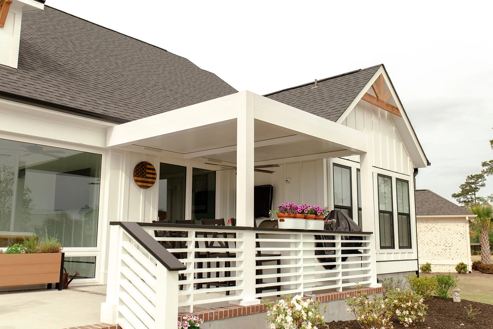 Azenco pergola with adjustable louvers providing shade and ventilation