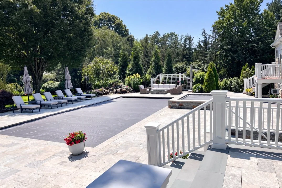 Outdoor living patio design with custom pavers and seating for relaxed gatherings in Port Washington, NY