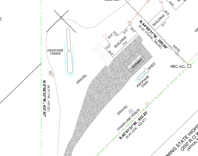 Site plan showing propane tanks, gravel areas, and a chain link fence, with boundary lines and measurements.