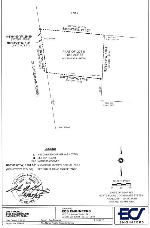 Survey map of a parcel of land showing lot boundaries, measurements, and coordinates in Wyoming. The map includes a legend for recovered corners, measured bearing and distance, and record bearing and distance. It has a scale of 1 inch equals 60 feet and a compass rose indicating north.