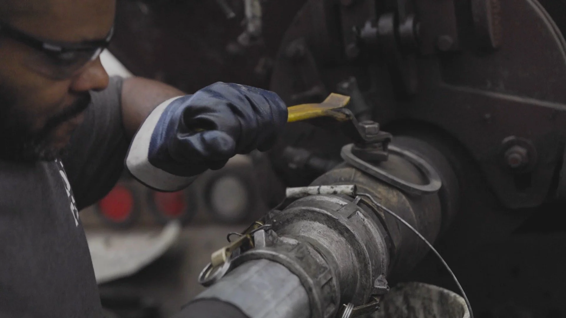 SuperVac industrial vacuum truck removing sludge from a tank at a paper mill in Louisiana