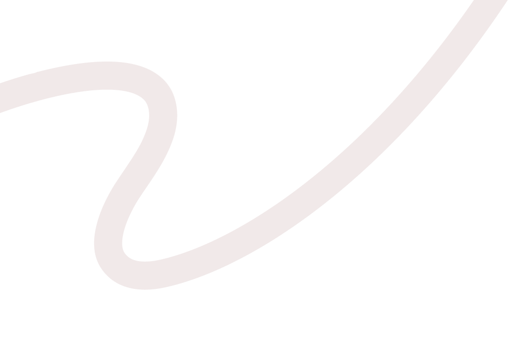 Close-up of a beige-colored, curved, hand-drawn or stylized letter 'S' on a black background.