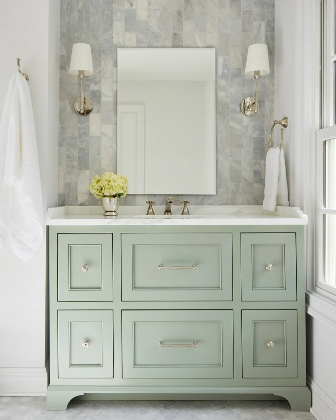 With Spring and St. Patty's on the way, we can't stop thinking about this dreamy green bathroom in one of our recent whole-home renovations.  We love the custom cabinetry by @harperandtaylorwoodworks in the prettiest sage paint, complemented with cla
