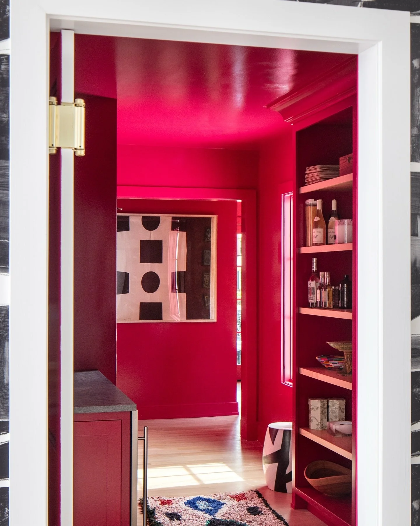 High-gloss red for the win!  Custom built-ins in the butler's pantry and a window seat in the mudroom were all painted in the prettiest high-gloss shade of red, and we couldn't love it more.  Bravo to these owners for making daring design choices to 