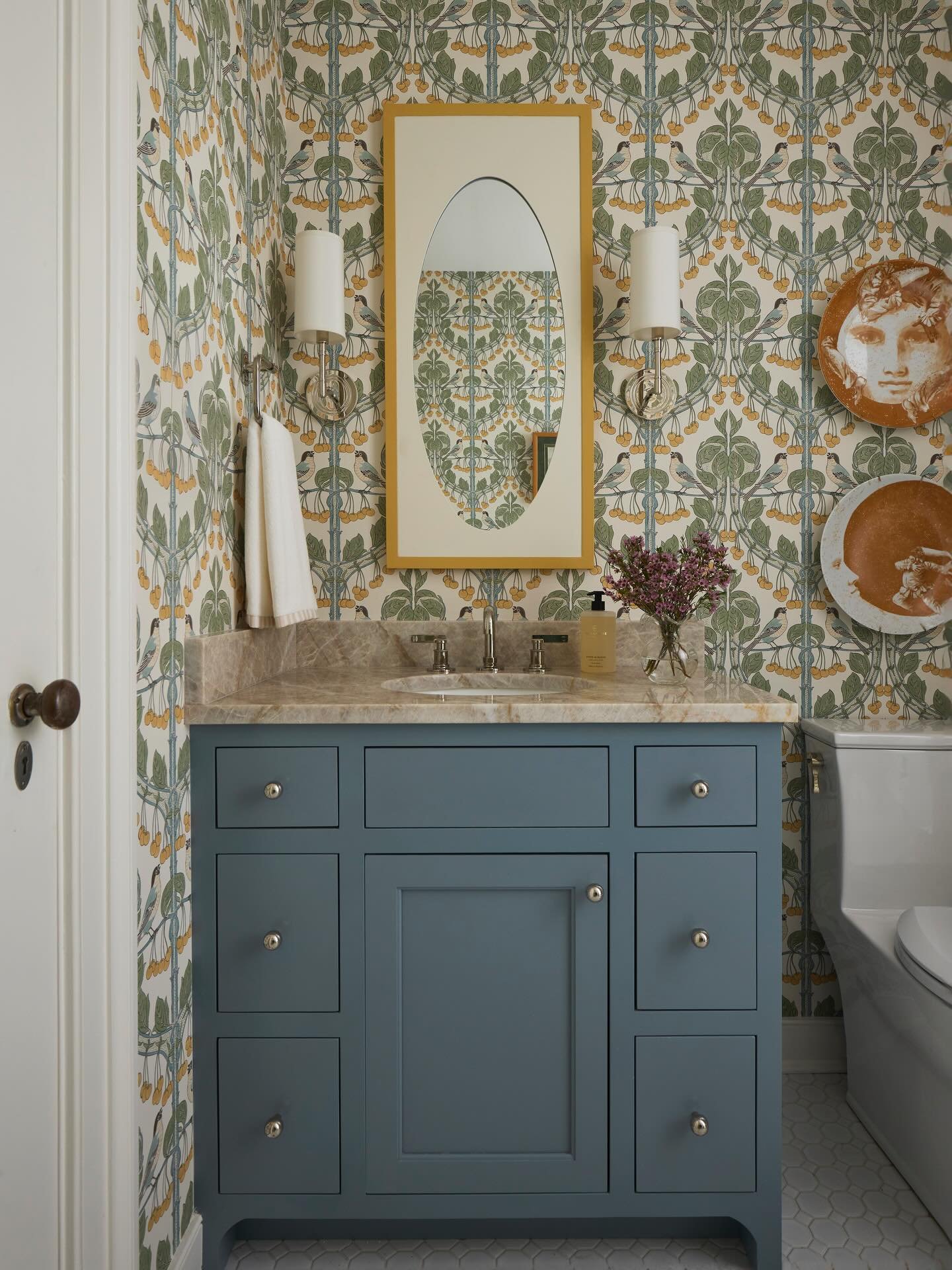 If November was a bathroom, this may be the one! Designed by @jtwdesignllc with custom cabinetry by @harperandtaylorwoodworks &amp; stone by @empirerva, we love the colors, the wallpaper, the styling, and all the custom features (like the motion-acti