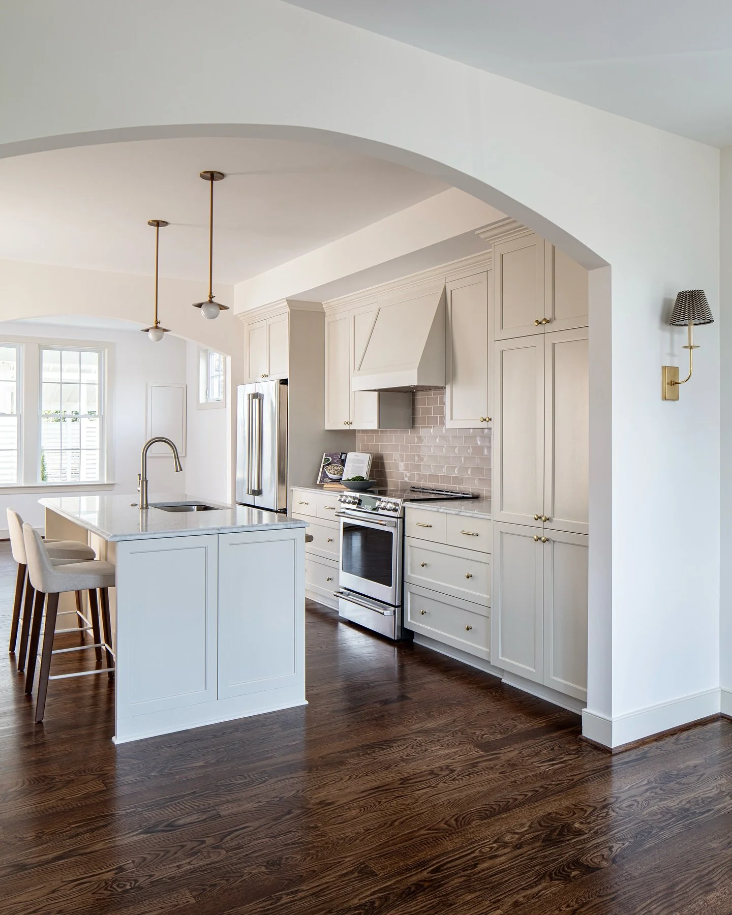 Same kitchen, two lovely views captured by @gordongregoryphoto.  This beautiful galley kitchen, designed by @jtwdesignllc, is a small-space powerhouse with an appliance garage/pantry and plenty of space-saving features.  Soft edges, warm finishes, an