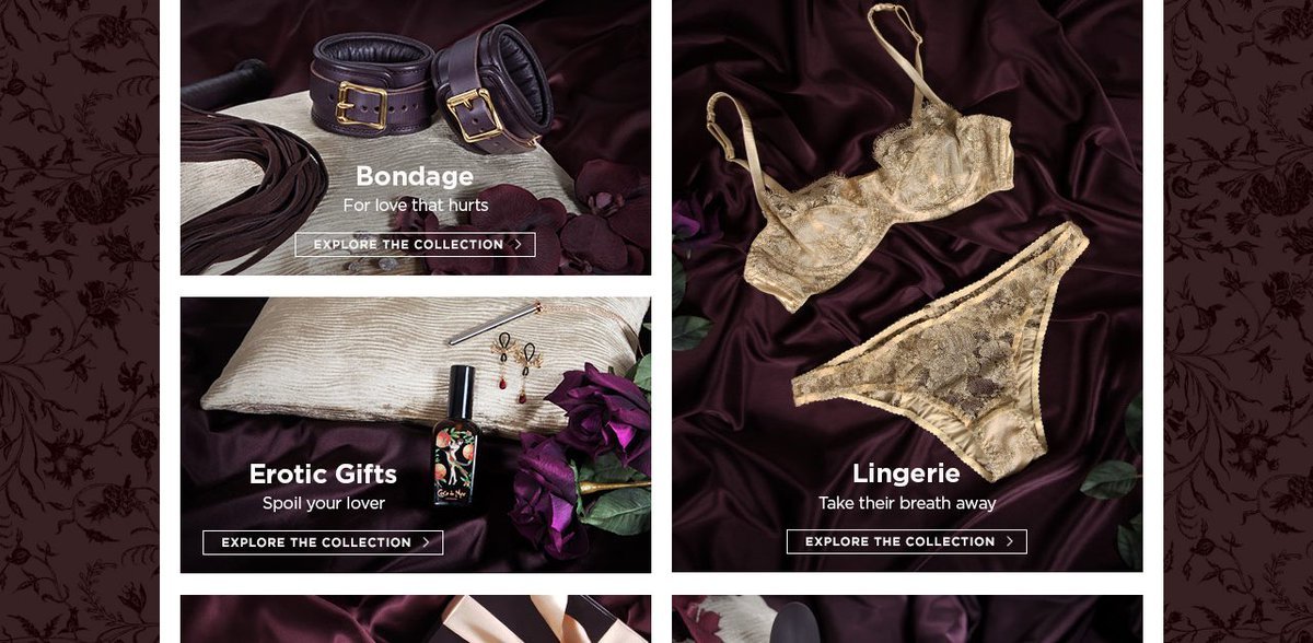 Collection of intimate and romantic items including a gold lace lingerie set, a pillow with jewelry and perfume, a belt, and a lace blindfold, all arranged on dark purple satin fabric.