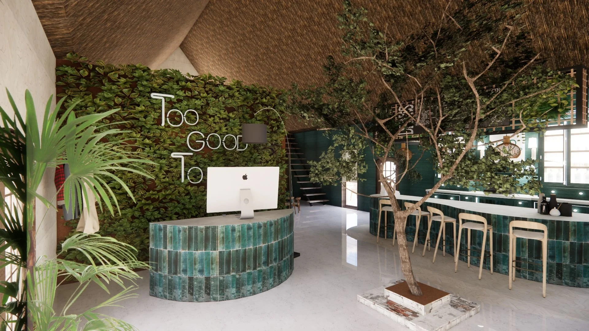 Modern interior of a cafe or restaurant with a green tile counter, a large indoor tree, and a green wall with the words 'Too Good To' in neon lights.