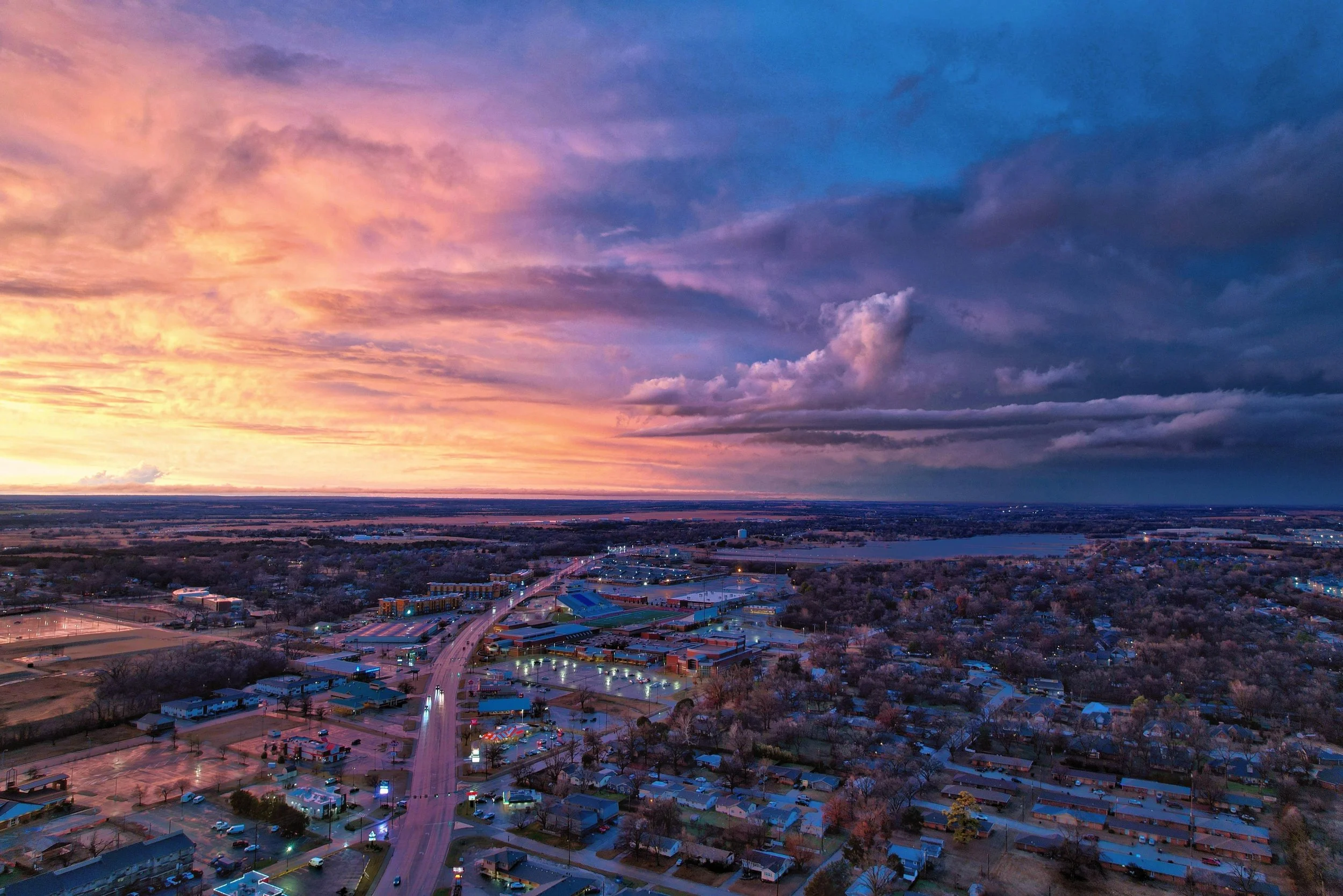 Aerial view of a town in Oklahoma at sunset, not far from where Eyrolles Law PLLC offers affordable, flat fee legal services to rural Oklahomans.
