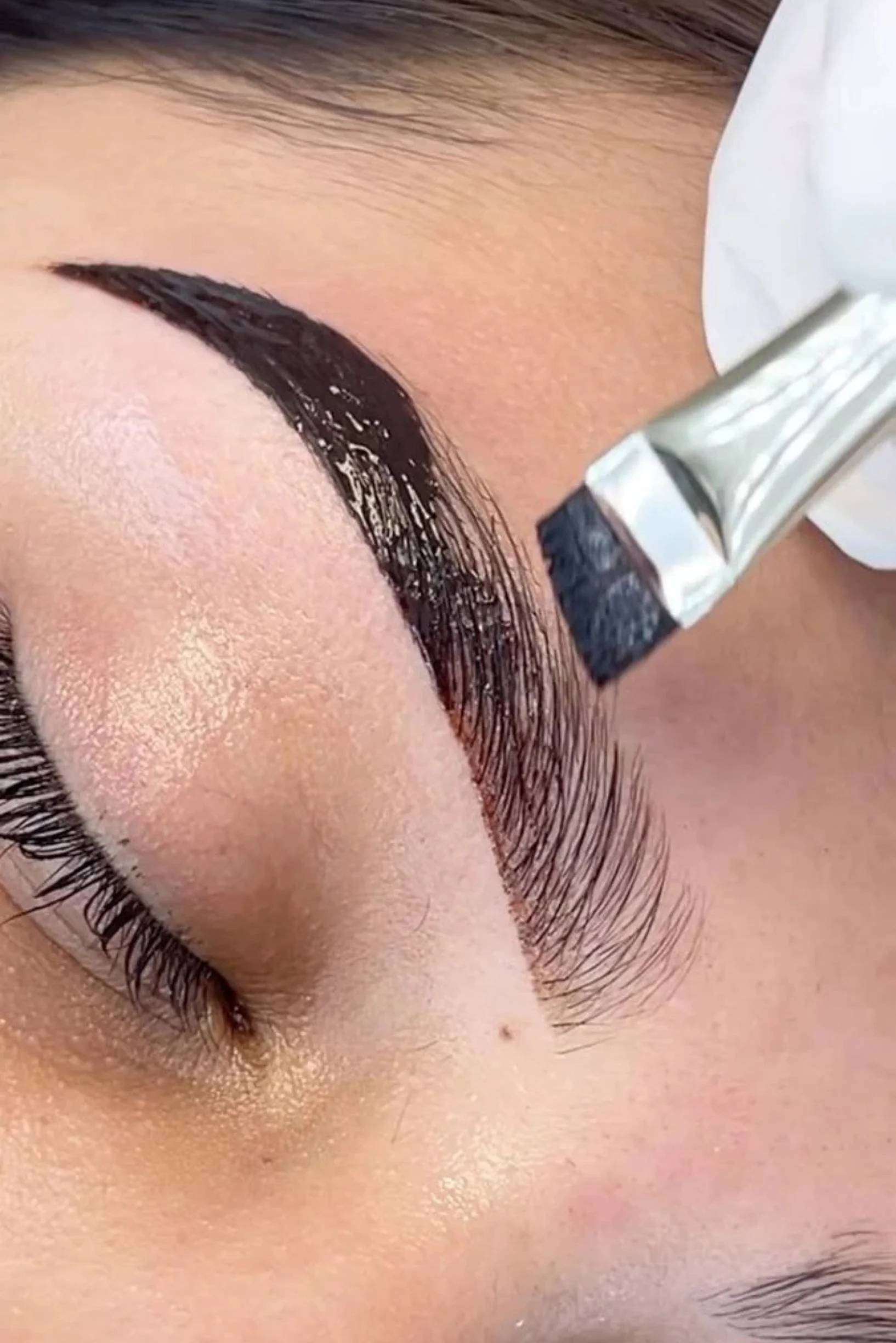 Female client receiving a brow tint at Preparations Skin Spa