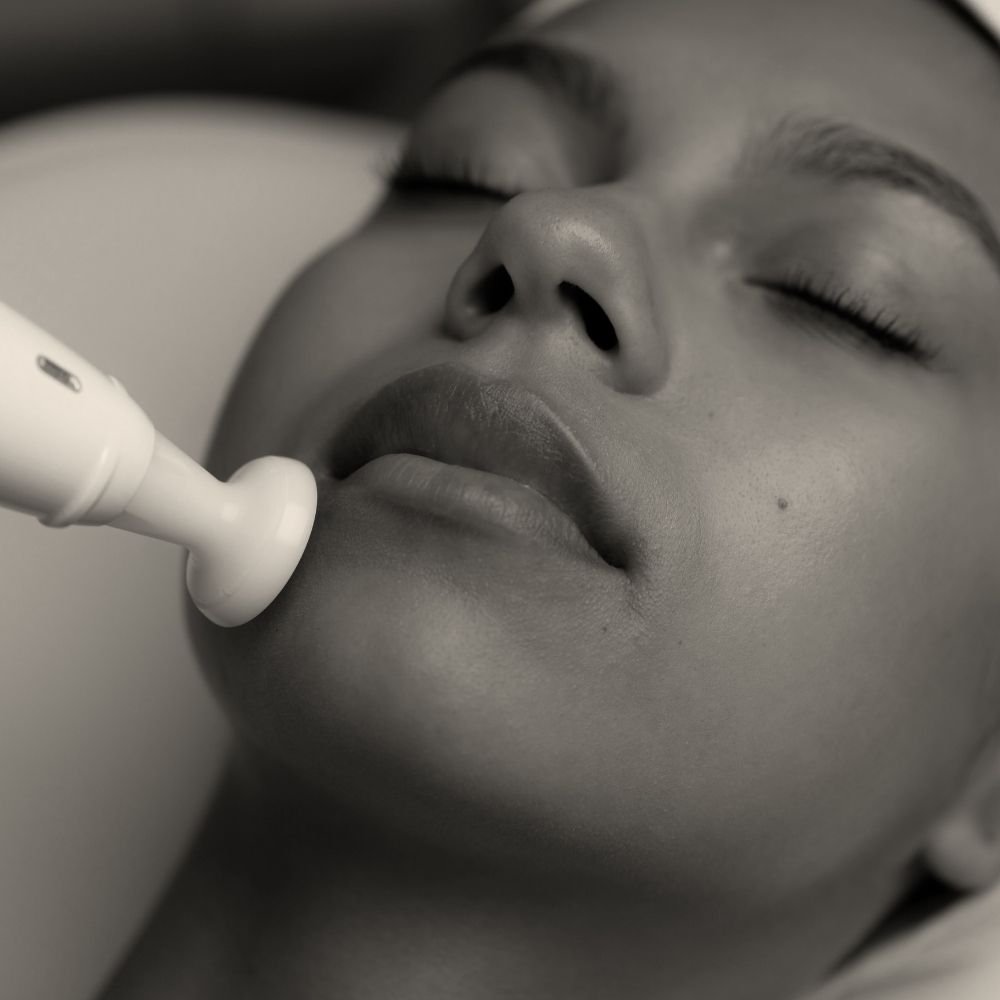 Female client receives customized, advanced skin treatment at Preparations