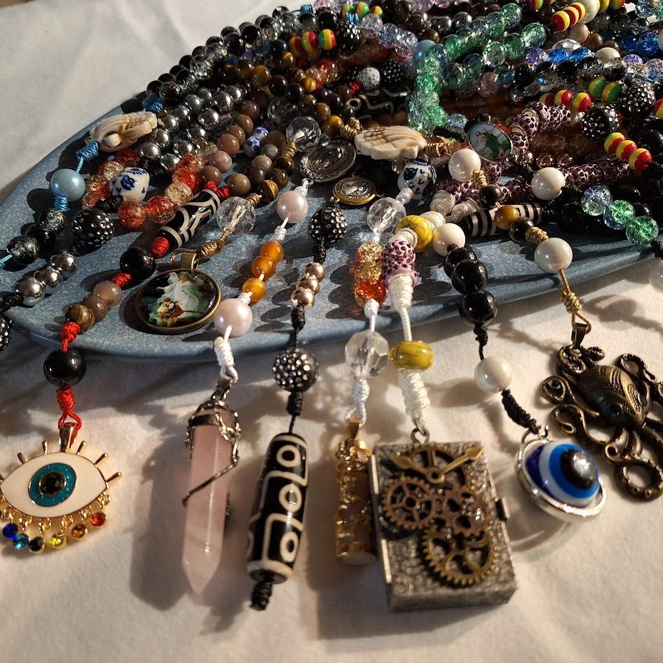 Various beads on a plate and spilling over.