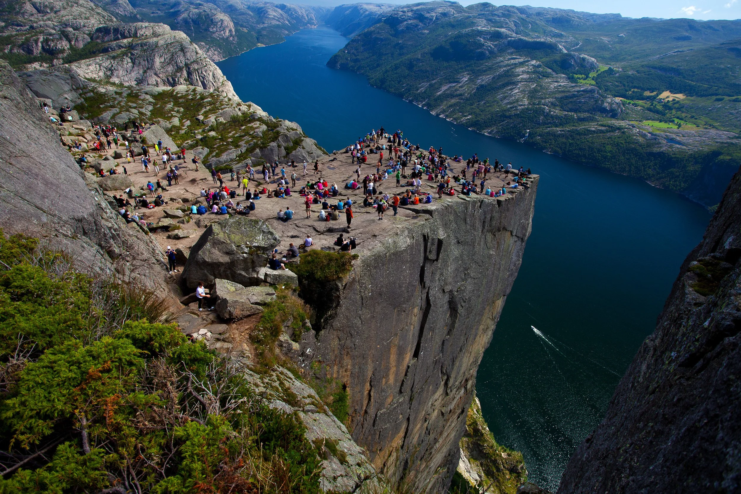 From Preikestolen, 604 metres above the Lysefjord, the water stretches far below — a sheer, unforgettable drop into deep-blue Norway.