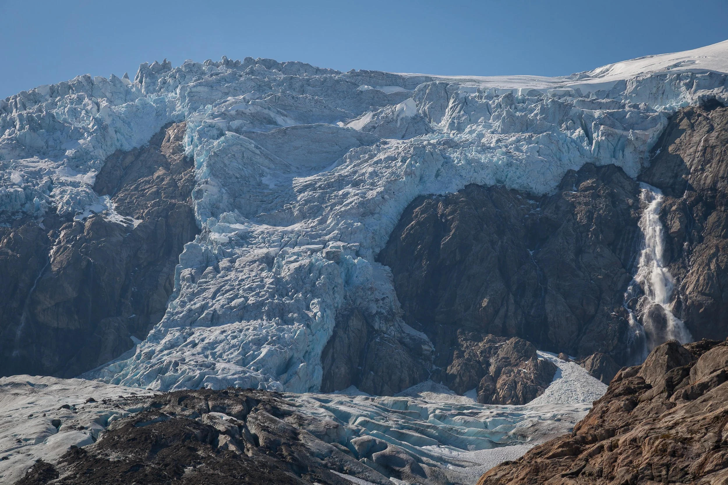 Close to Buarbreen, a glacier arm of Folgefonna, where compressed blue ice breaks into rough ridges above the rock.