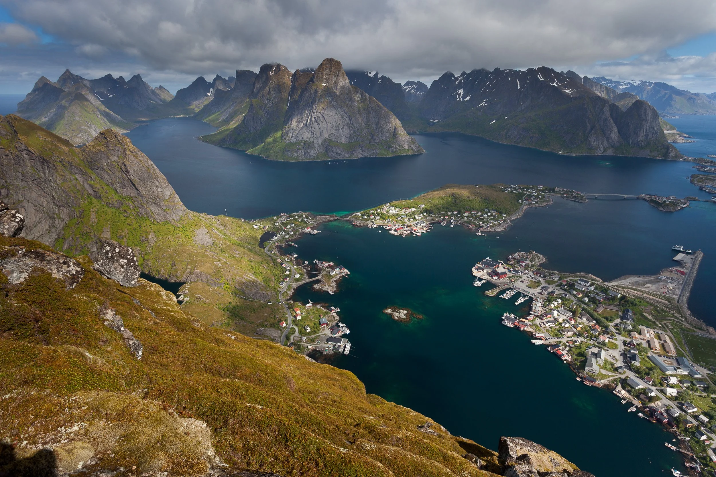 View from Reinebringen above Reine in the Lofoten Islands, Norway – panoramic fjords, islands and jagged mountain ridges.