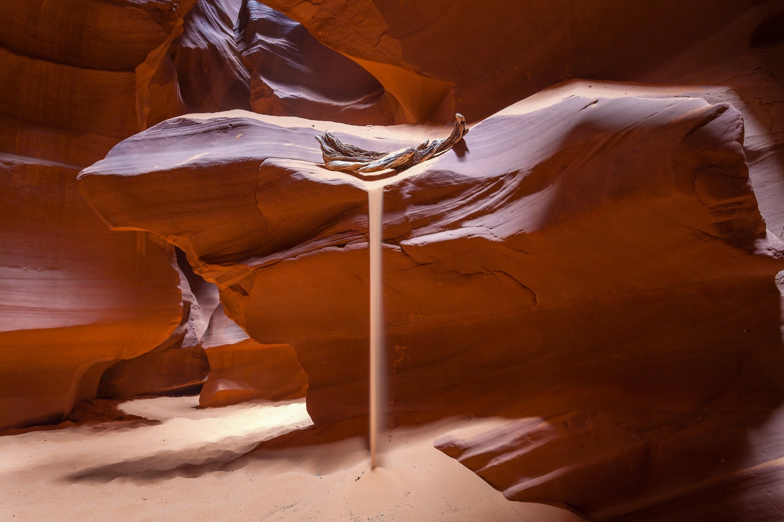 A falling ribbon of sand inside Antelope Canyon, Arizona.