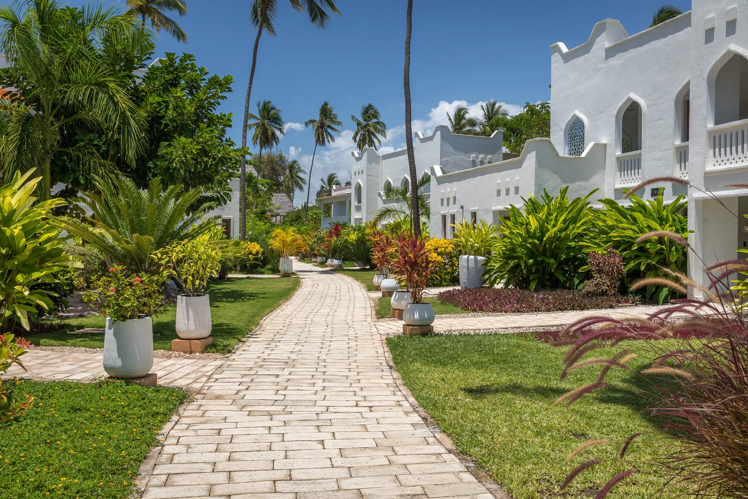 LUX Marijani Beach Resort, Zanzibar – palm-fringed shoreline, white sand and a shallow turquoise lagoon on the east coast of the island.