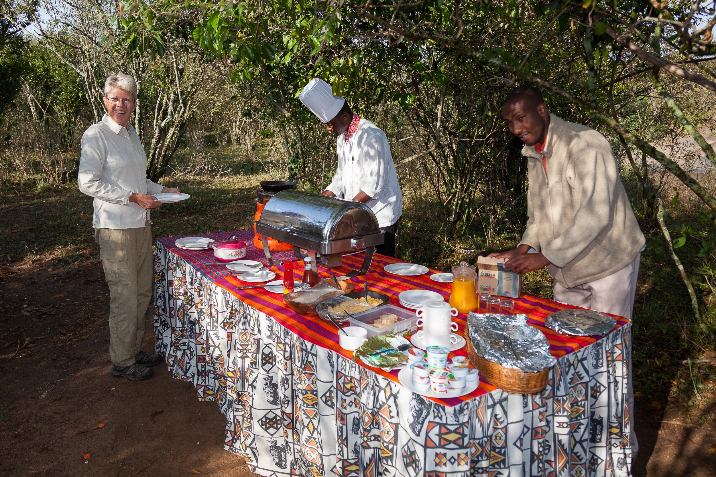 Breakfast in Maasai Mara National Reserve, Kenya – classic bush breakfast set out on the open savanna after an early game drive.