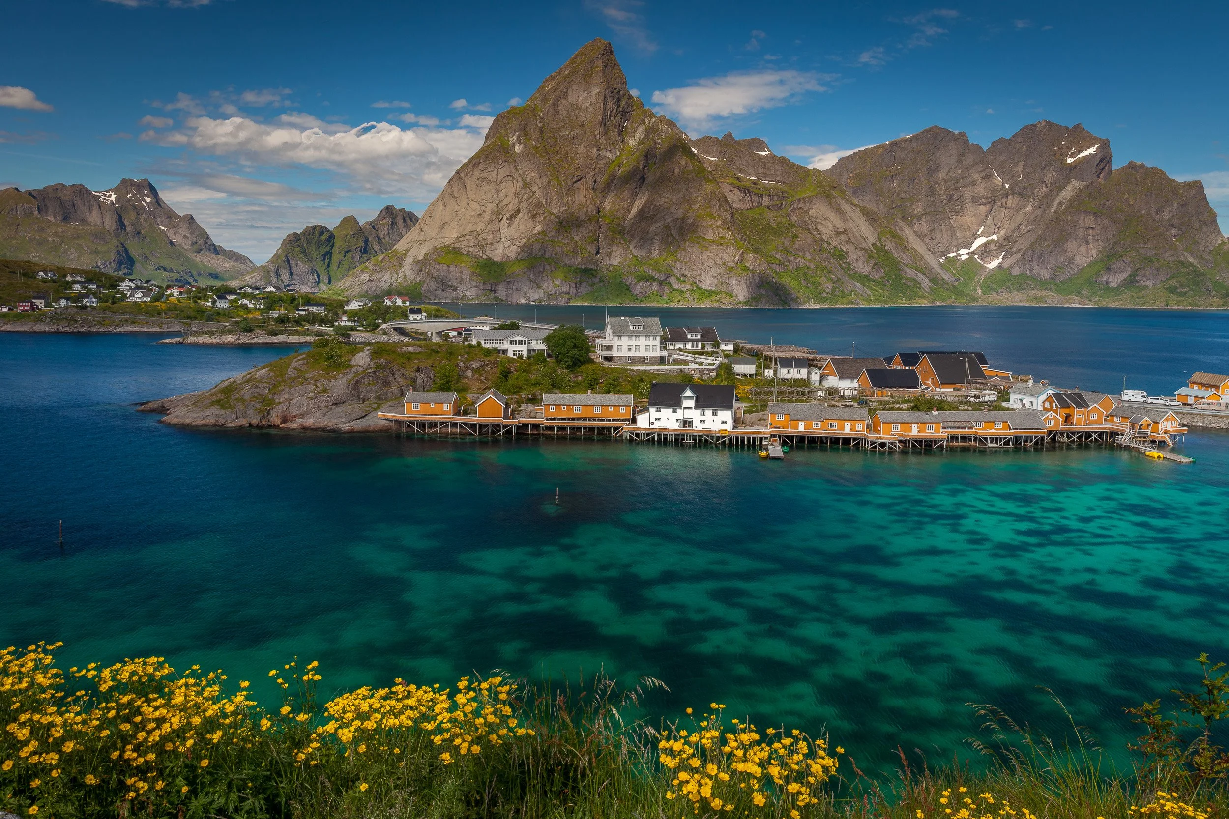 Sakrisøy in the Lofoten Islands, Norway. Click to see the video that goes with this Lofoten series – filmed in June 2025 with drone shots from Reine and Henningsvær.