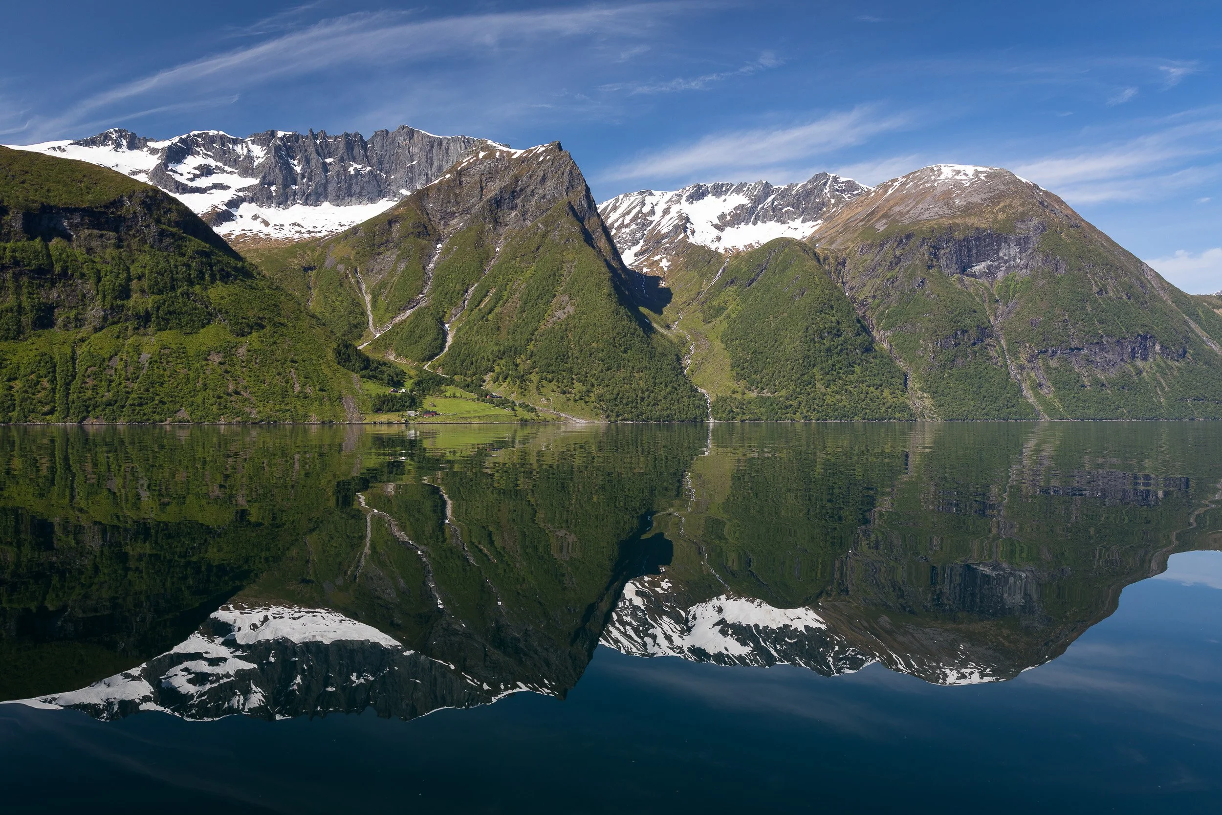 Hjørundfjorden opens up ahead — rugged mountains, deep water, and that wild sense of travelling through untouched Norway.