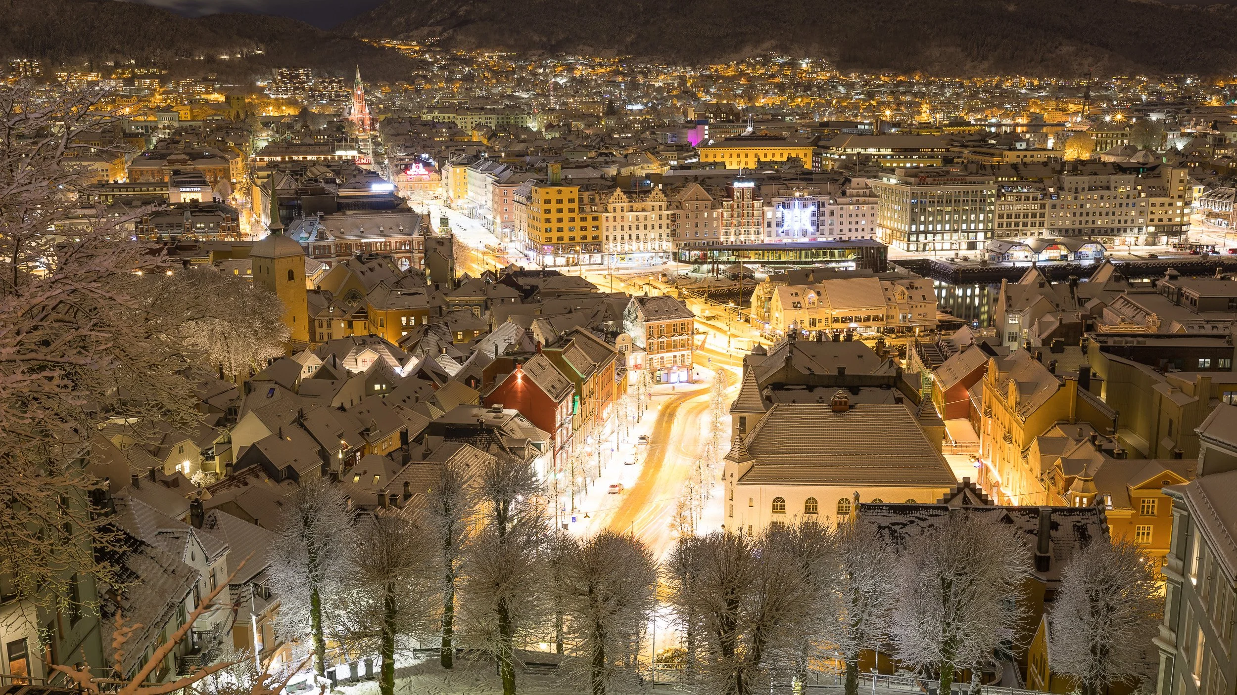 My hometown Bergen in Western Norway – historic wooden houses framed by the surrounding mountains.