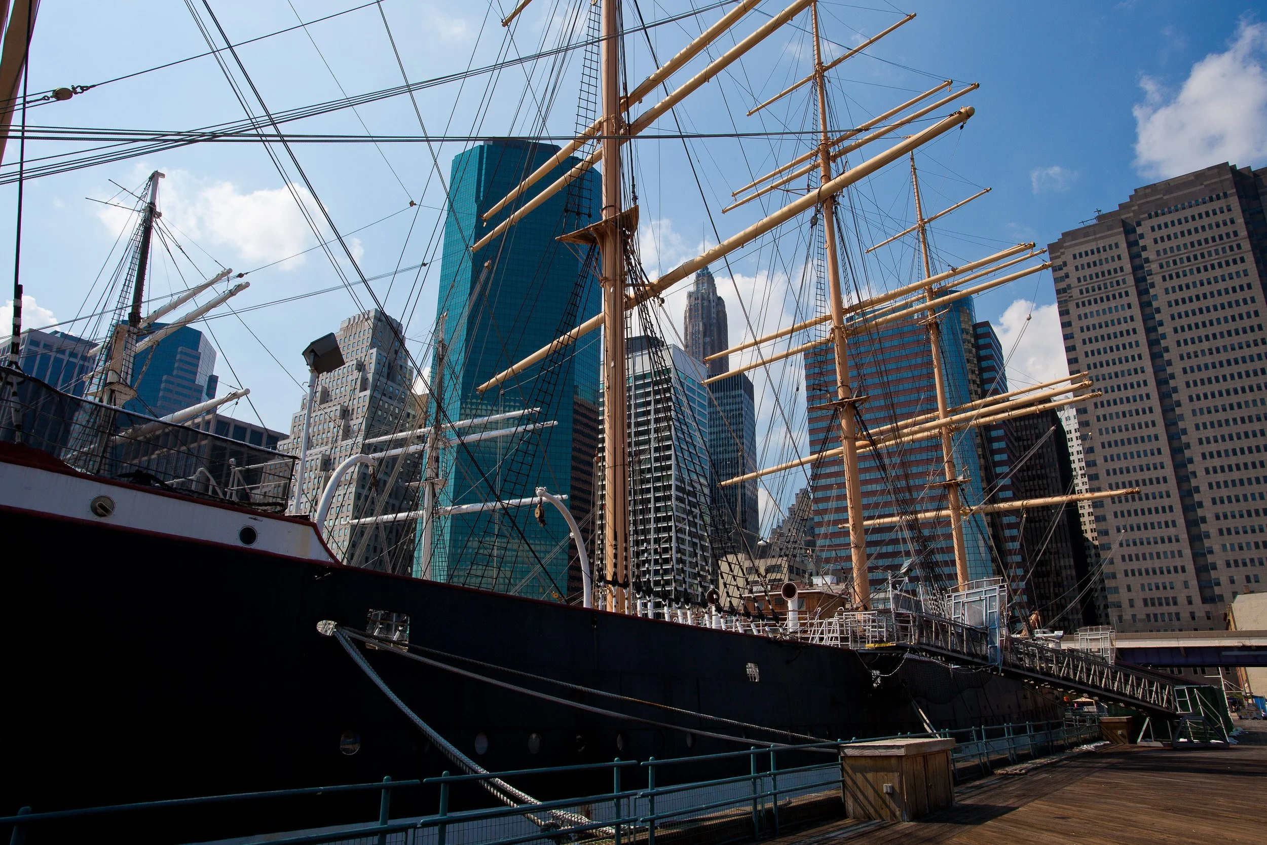 Historic ships and modern skyscrapers meeting at South Street Seaport.