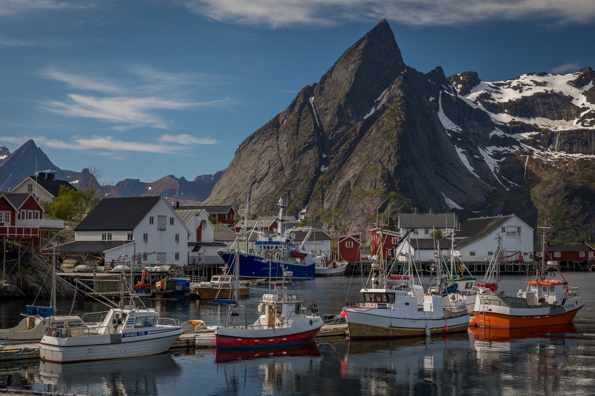 Hamnøy in the Lofoten Islands, Norway – iconic fishing village with red cabins and a dramatic backdrop of jagged peaks.