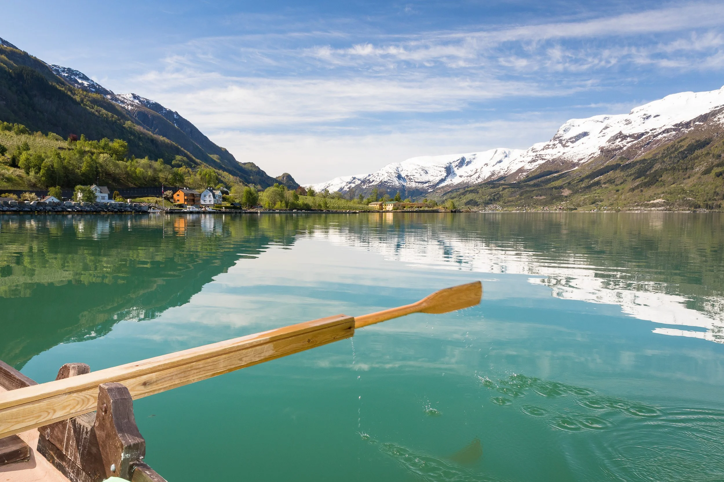 Sørfjorden in Hardanger — wide, calm water and mountain slopes under clear skies, with that crisp Hardanger light.