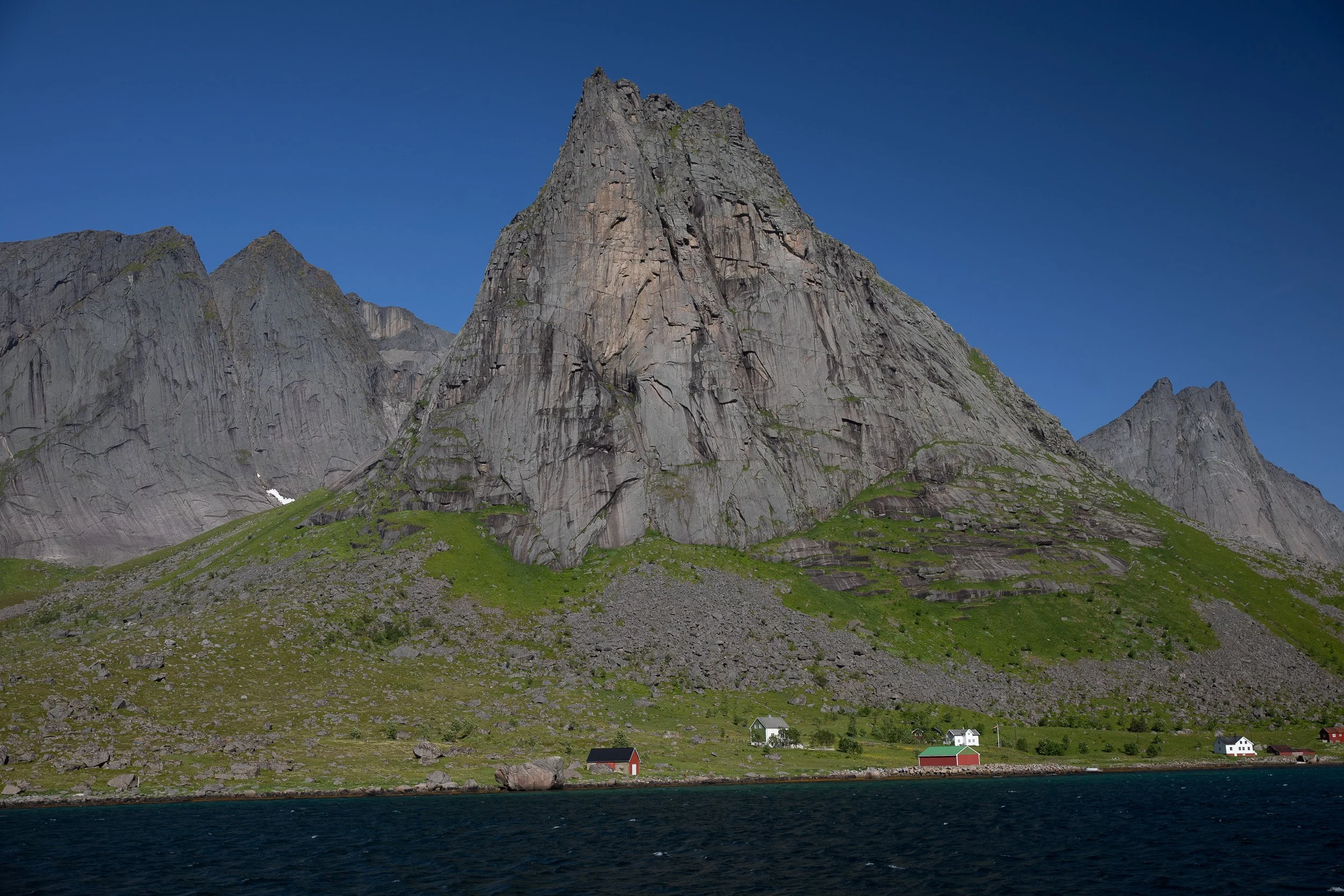 Kjerkfjorden, Lofoten — a narrow fjord passage where cliff walls and calm water pull you deep into the landscape.